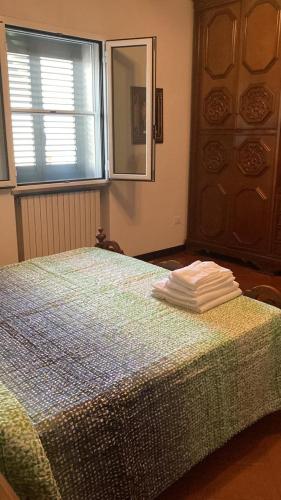 Ένα ή περισσότερα κρεβάτια σε δωμάτιο στο Appartamenti Podere 270