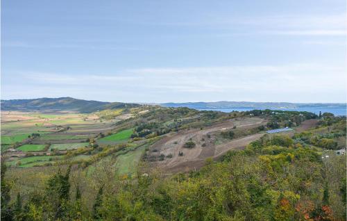 an aerial view of a valley with trees and the ocean at Stunning Home In Valentano With Kitchen in Valentano