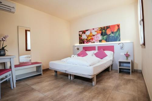 Un ou plusieurs lits dans un hébergement de l'établissement Hotel Firenze 3 Stelle Superior