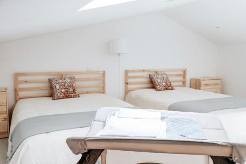 A bed or beds in a room at Rest House - Vila do Conde