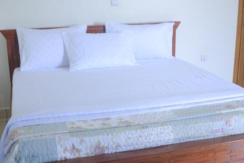Ένα ή περισσότερα κρεβάτια σε δωμάτιο στο Macchiato Suites Boutique Hotel