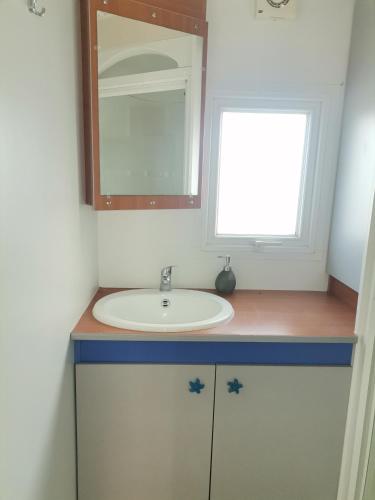a bathroom with a sink and a mirror at Camping Albox in Albox