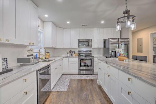 a kitchen with white cabinets and stainless steel appliances at World Cup Base Less Than 3 Mi to Mercedes-Benz Stadium! in Atlanta