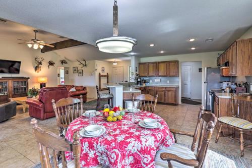 a kitchen and living room with a table and chairs at Charming Cameron Farm Retreat about 41 Mi to TAMU in Cameron