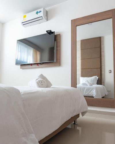 Una cama o camas en una habitación de Primavera Plus
