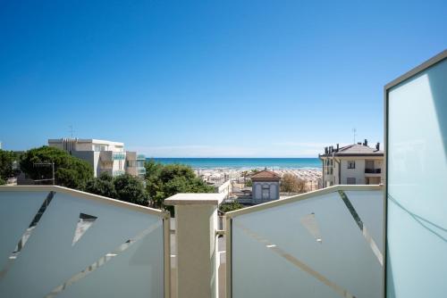 a view of the ocean from the balcony of a house at Hotel Radar in Rimini