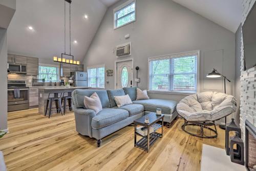 a living room with a couch and a table at Near Lakes and Resorts Pet-Friendly Long Pond Abode in Long Pond