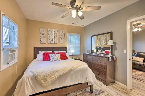 a bedroom with a bed and a ceiling fan at Council Bluffs Cottage Proximity to Parks! in Council Bluffs