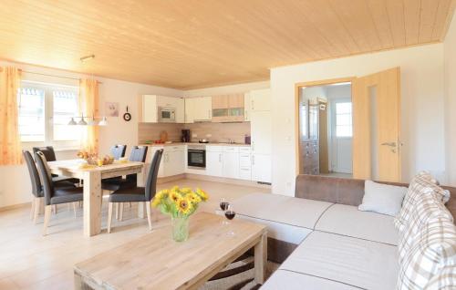 a living room with a couch and a table at Ferienhaus 3 Altefähr in Altefähr
