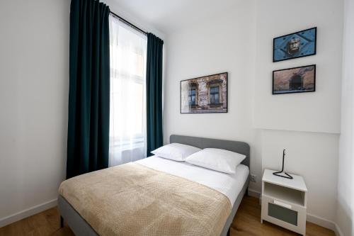 מיטה או מיטות בחדר ב-Native Apartments Paulińska 20 Superior