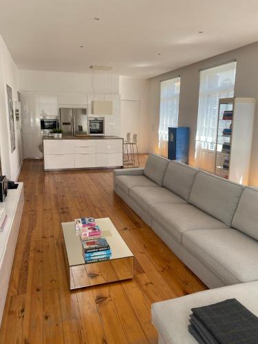 a living room with a couch and a table at City center boutique apartment in Funchal
