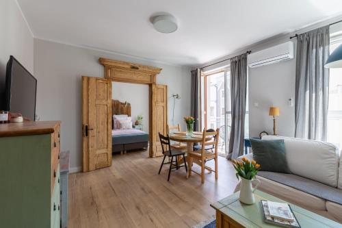 Ένα ή περισσότερα κρεβάτια σε δωμάτιο στο Apartament Bulvar Premium Starówka garaż gratis !