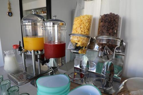 a counter with a bunch of different types of food at Oskar Hotel in Sarandë