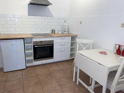 a kitchen with a stove and a counter top at Herbeder Straße in Witten