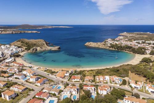 an aerial view of a beach with houses and the ocean at Apartamento CASTELLSOL 309 by Mauter Villas in Arenal d'en Castell