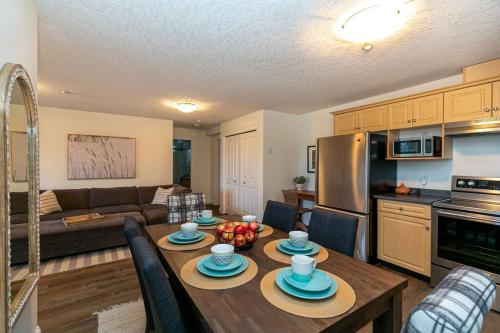 a kitchen and living room with a table and a couch at Cozy Renovated Oasis W Private Terrace & Parking in Victoria