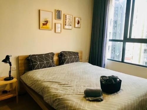 Giường trong phòng chung tại Lagom service apartment Ho chi minh city - airport