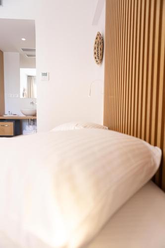 a close up of a bed in a bedroom at Dimani Suites in Gythio