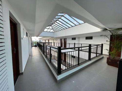 an empty hallway with a skylight in a building at Aloha Holiday Resort in Baga