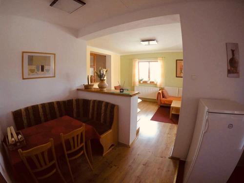 a living room with a couch and a table at Vila Daja in Podhájska
