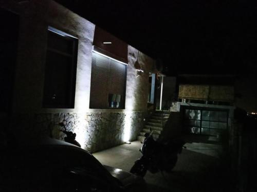 a dark room with stairs and a window in a building at Apartmani Bella in Sutomore