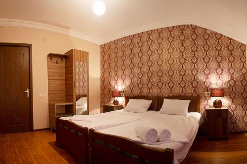 Postel nebo postele na pokoji v ubytování Mestia Residence