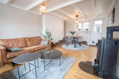 a living room with a couch and a table at The yellow door in Stavanger