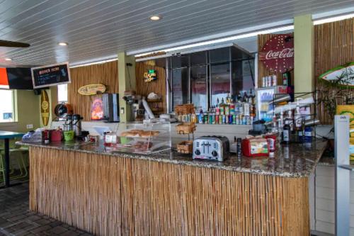 a bar in a fast food restaurant with a counter at Amazing Waterfront Views Resort, Enjoy Heated Pool & Sunset! in Tampa