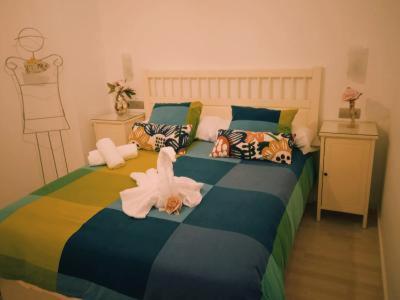 Ein Bett oder Betten in einem Zimmer der Unterkunft Apartamento Sissi