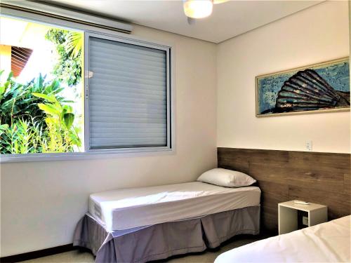 En eller flere senge i et værelse på CASA na Praia PERFEITA DE JUQUEHY