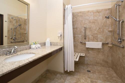 a bathroom with a sink and a shower at Holiday Inn Express & Suites Glendive by IHG in Glendive