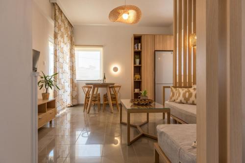 a living room with a couch and a table at Eden of grameno Luxury sea view apartment in Palaiochora