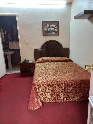 Cama o camas de una habitación en Hotel Gomez de Celaya