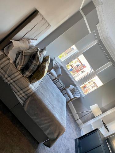 an overhead view of a living room with a bed and chairs at Ellwyn House in Edinburgh