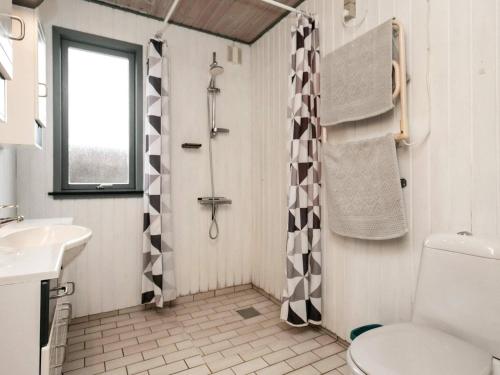 a bathroom with a toilet and a shower at Holiday home Bogense XXXIII in Bogense