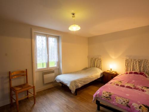a bedroom with two beds and a window at Maison indépendante en pleine nature dans la Vallée de l'Auvézère - FR-1-616-140 in Saint-Mesmin