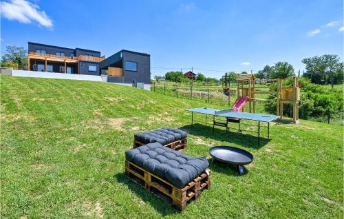 a house on a hill with a table and chairs at Beautiful Home In Klostar Ivanic in Kloštar Ivanić