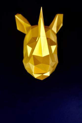 a yellow origami dog head on a black background at Jaukūs ART stiliaus apartamentai antrame aukšte su vaizdu į marias in Svenele