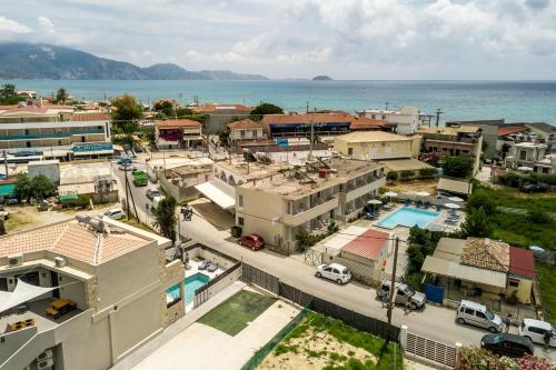 an aerial view of a town next to the ocean at Old Cinema Suites - Stylishly Decorated Retreat with Pool or Jacuzzi by the Sea in the Heart of Laganas Βy Villa Mana Gers in Laganas