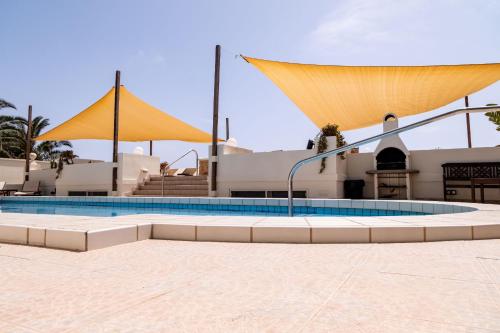 a swimming pool in front of a building at D View 4 You in Mellieħa