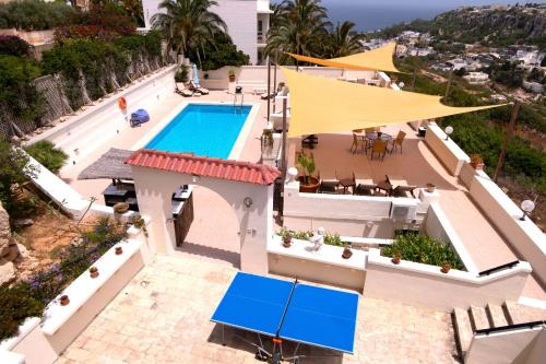 an aerial view of a house with a swimming pool at D View 4 You in Mellieħa