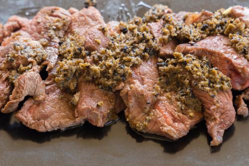 a close up of a piece of meat covered in spices at Borgo Incantato Spoleto in Pompagnano
