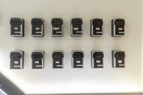 a row of electronic clocks on a wall at Casa del Patriarca in Valencia