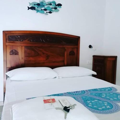 Una cama o camas en una habitación de I Baronetti in centro