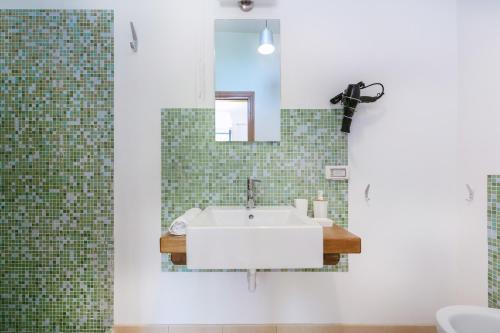 a bathroom with a sink and a mirror at Casa Giovanni da Procida in Procida