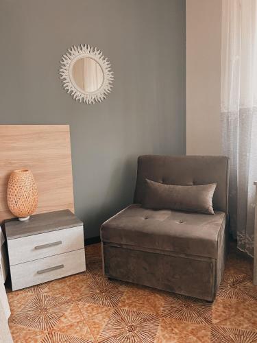 a bedroom with a bed and a mirror on the wall at B&B DOÑA FLOR in Parabita