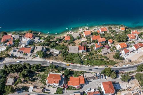 an aerial view of a village with a road at Apartments Drago Kovačić in Omiš