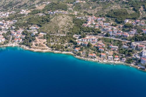 an aerial view of a small island in the water at Apartments Drago Kovačić in Omiš