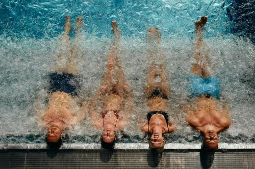 a group of people in the water in a swimming pool at The Cambrian in Adelboden
