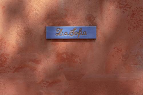 a blue sign on the side of a wall at Casa Giovanni da Procida in Procida